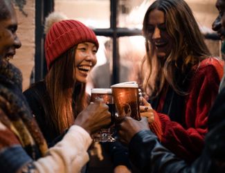 Festive drinks with friends and family in a heated Young's pub garden