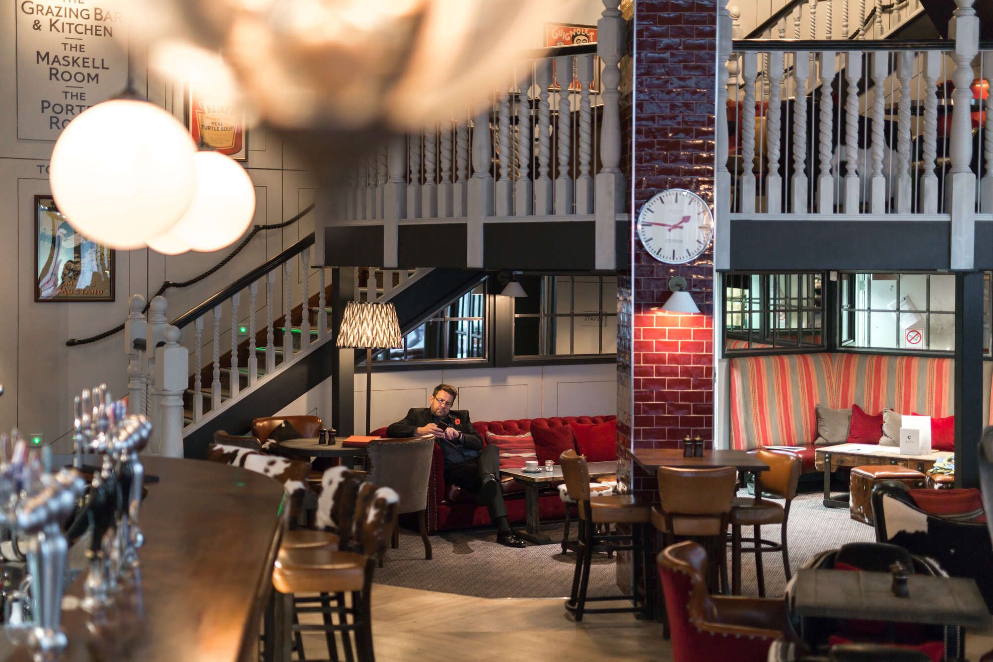 Main bar area on the main floor with staircase at the back