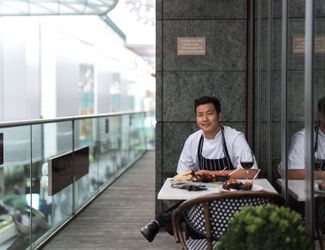 Chef sat outside on the terrace at The Bull