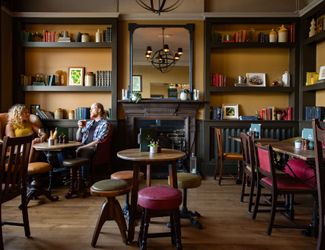Cosy fireplace at The Bull's Head in Barnes