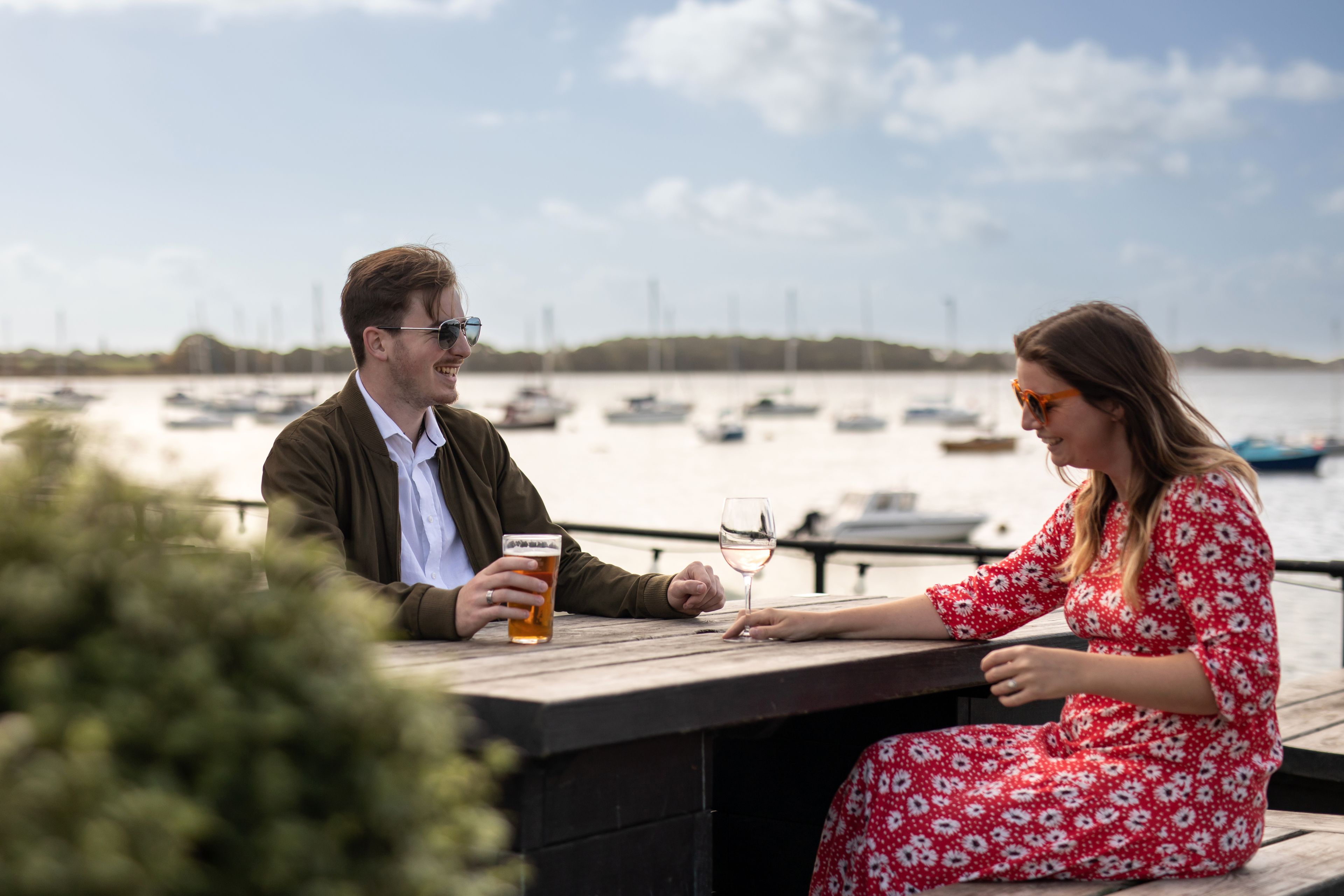 Young's Pub Garden - Couple on bench overlooking the water at the Crown & Anchor