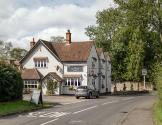 Exterior of the Half Moon Windlesham as seen from the road
