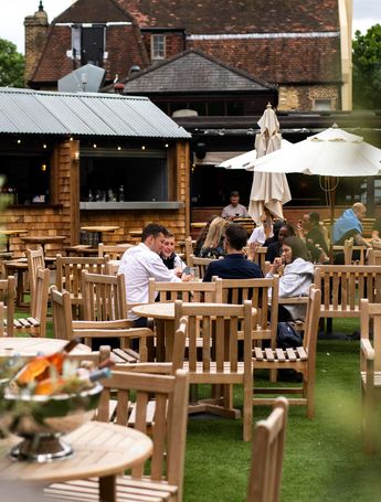People eating in a pub beer garden