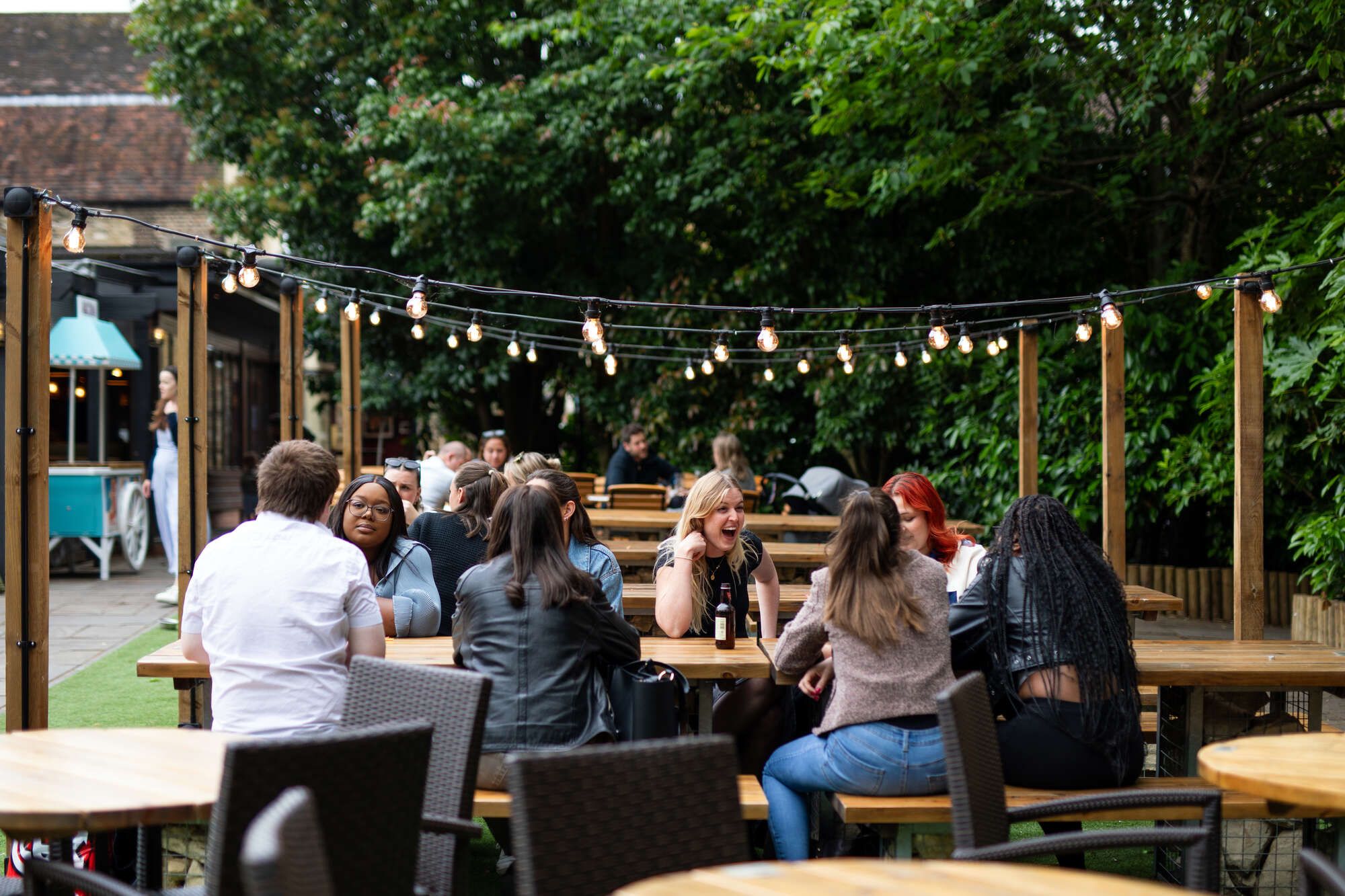 Drinking and eating with friends in a pub garden