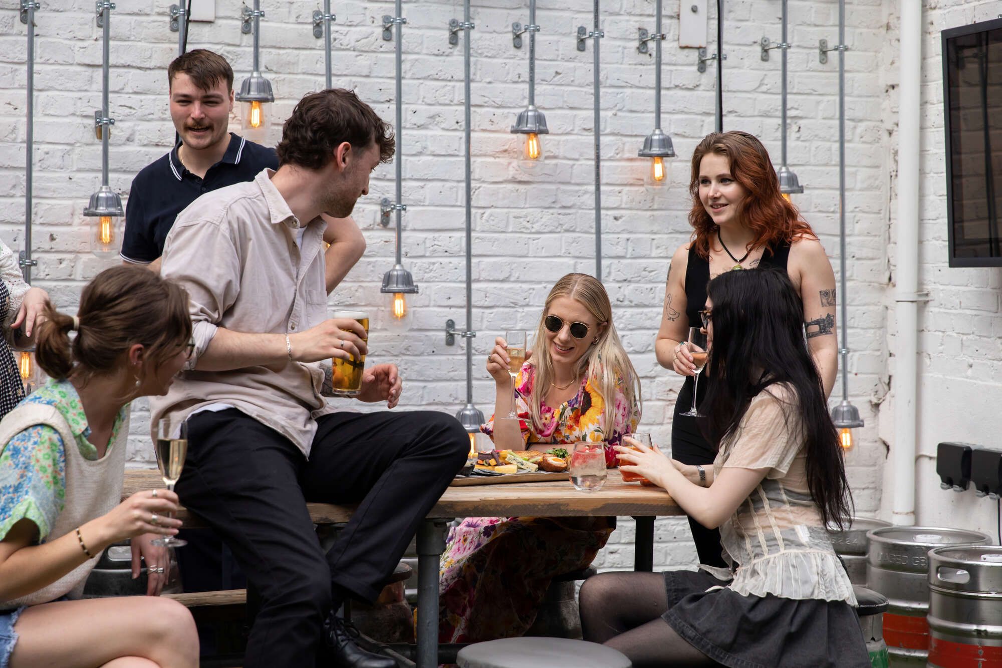 Friends in a pub garden enjoying a few drinks