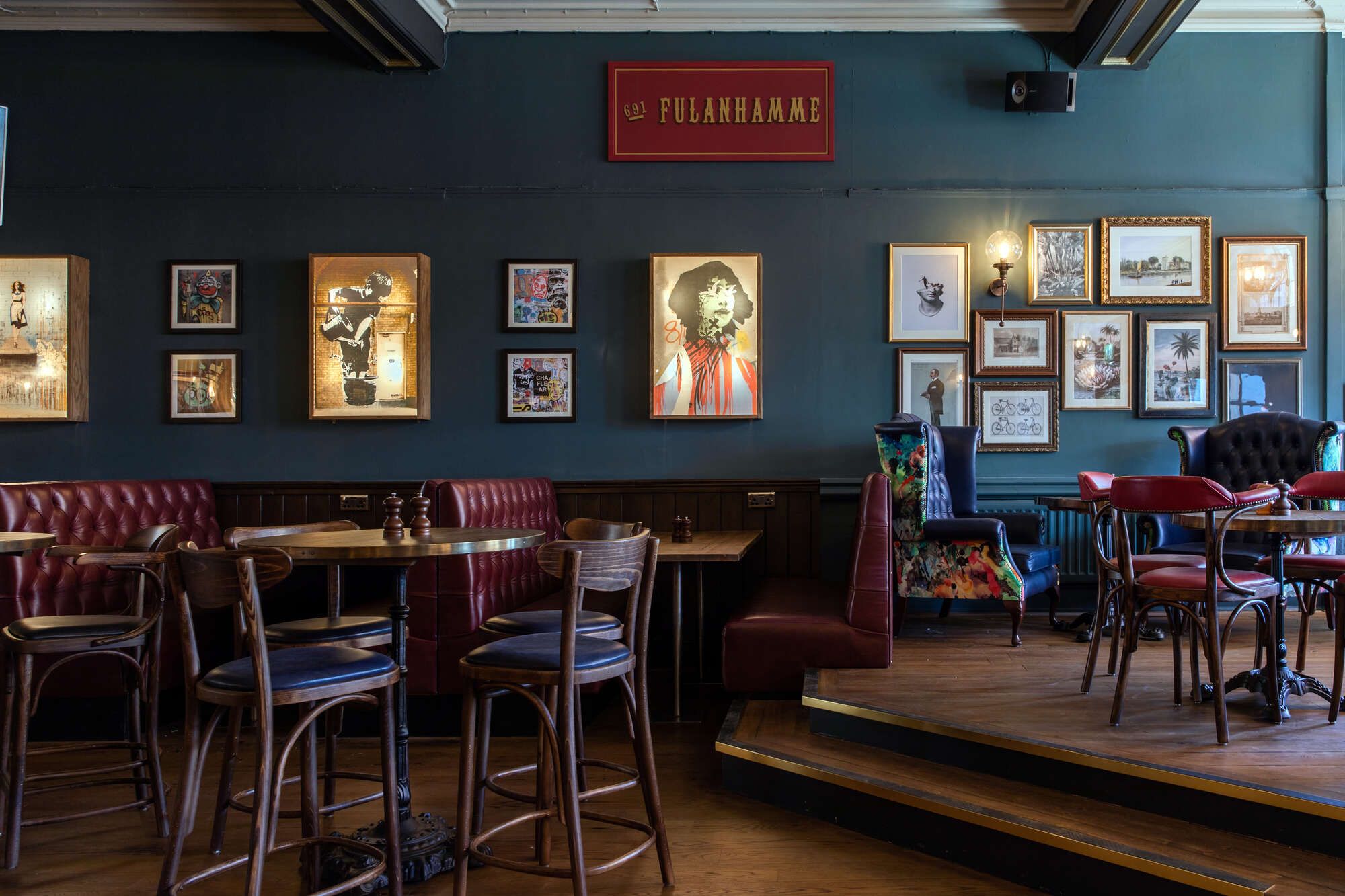 Tables and chairs inside the Cock Tavern