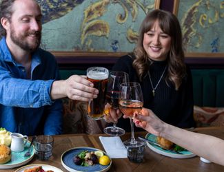 People celebrating with beer and food