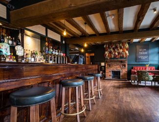 Cosy and historic bar area at The Bear, Cobham