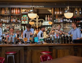 Team behind the bar at The Crown, St Margarets