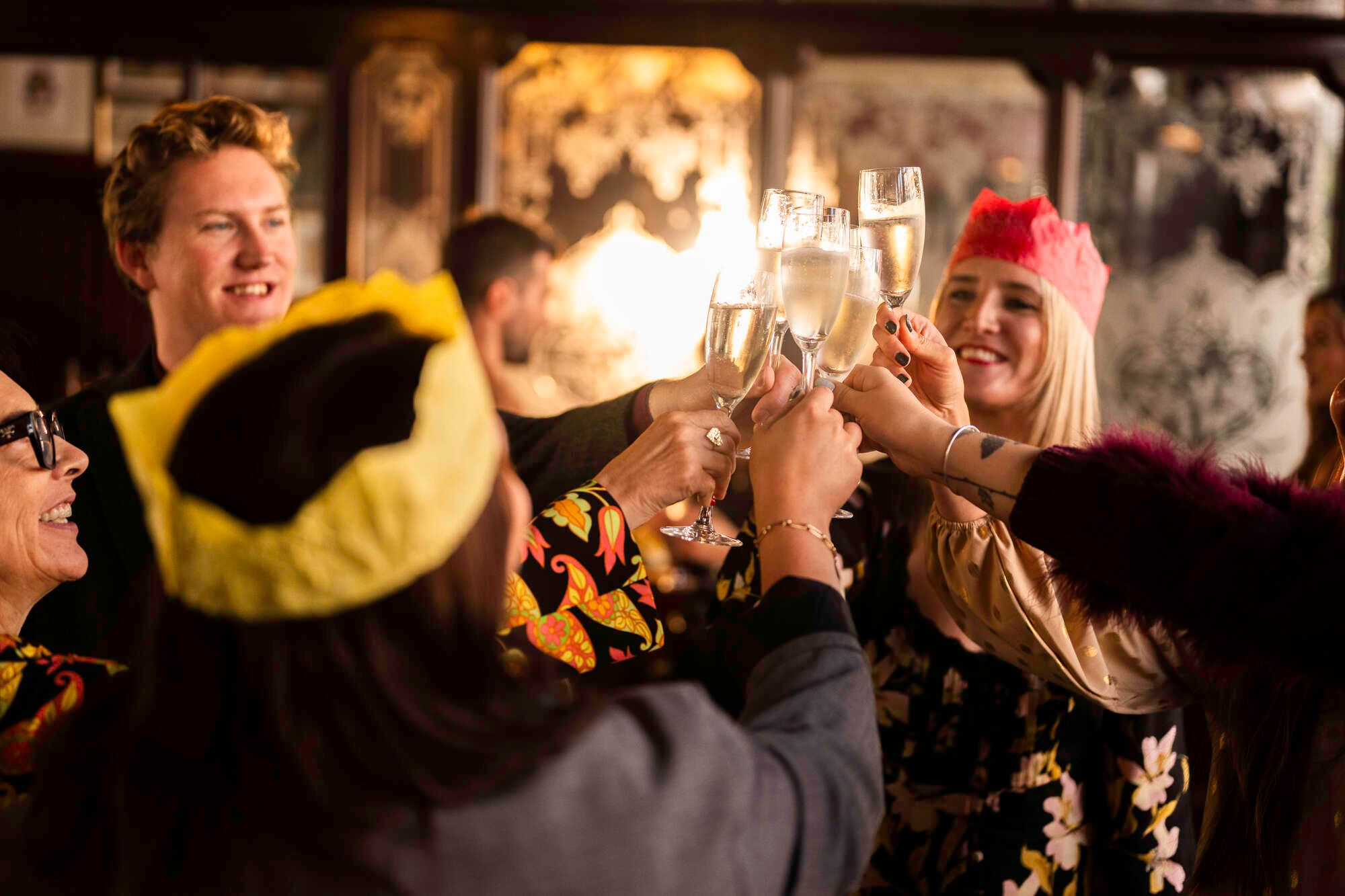 People celebrating at a Christmas party in a Young's pub
